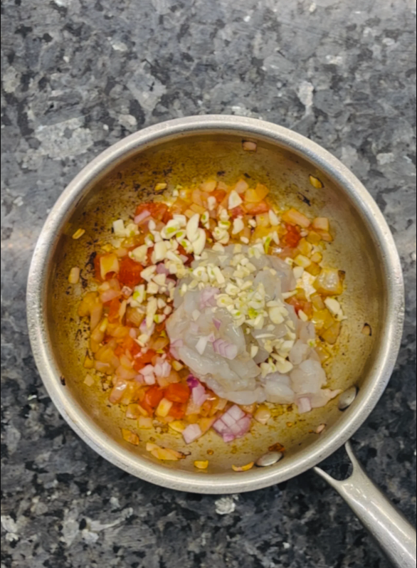 Add shrimp and garlic, cooking for another 4 minutes until the shrimp turn pink.