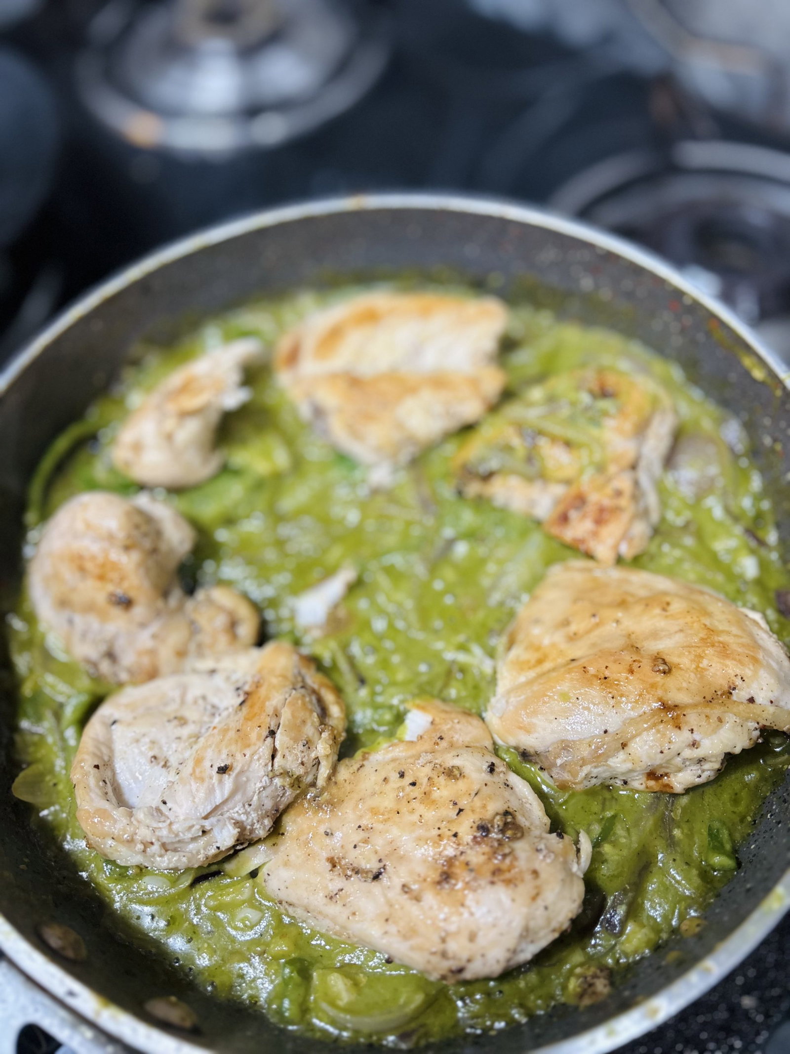 Bring to a simmer, return the chicken, cover, and cook until it reaches 165°F.