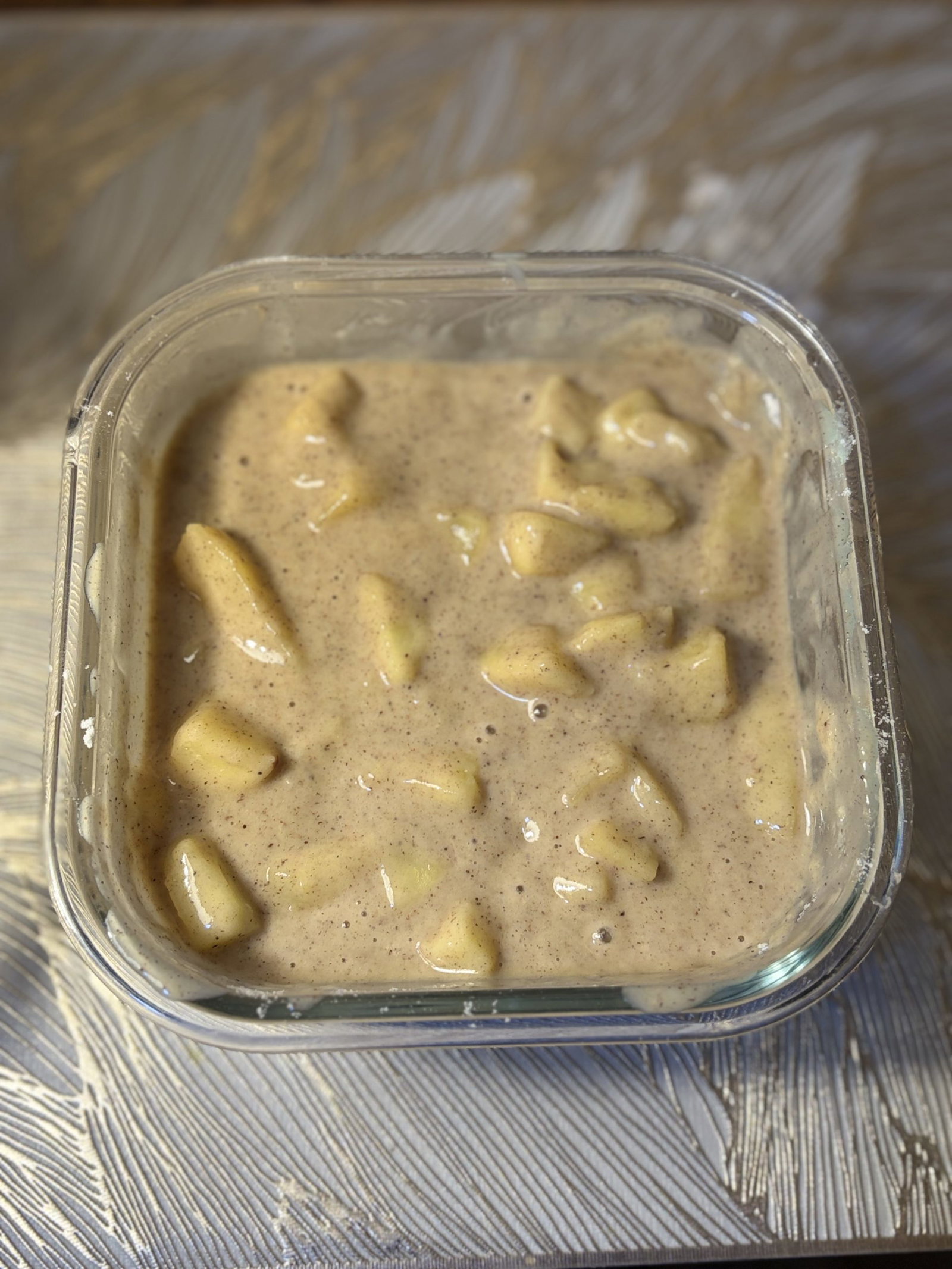 Fold the warm apples into the batter so every scoop has fruit.