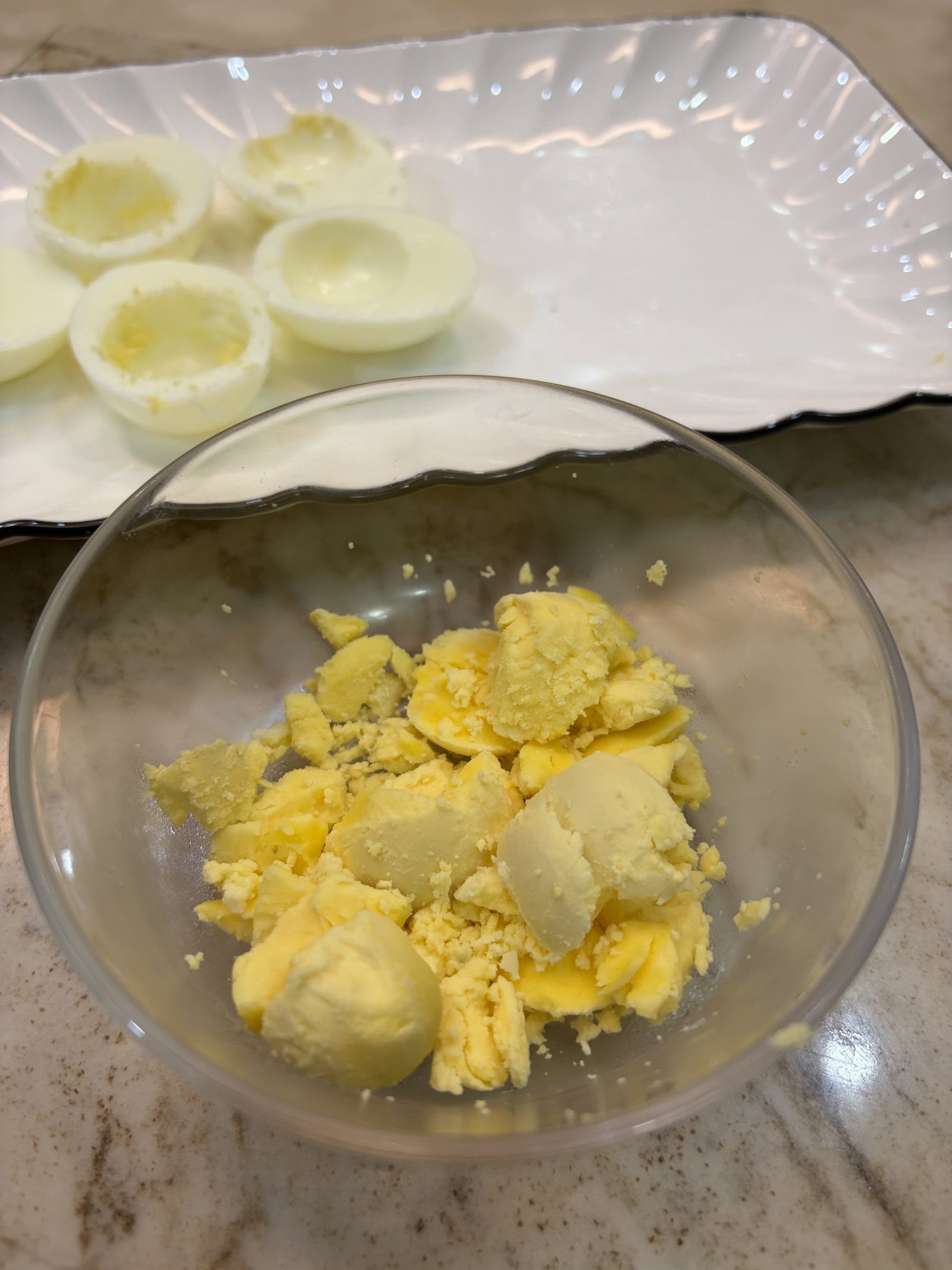 Gently remove the yolks and place them in a bowl