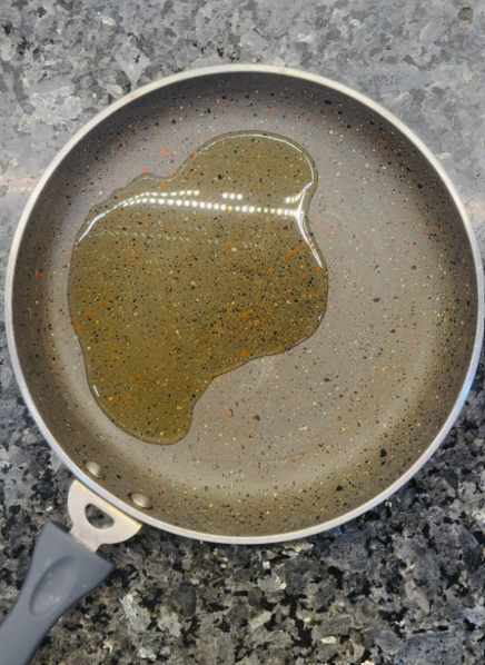 Heat a skillet over medium heat and add the oil