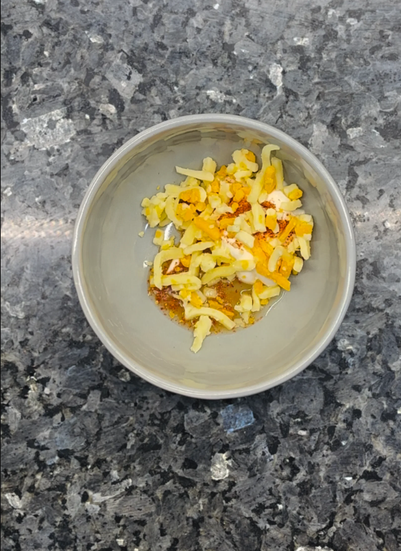 In a bowl, mix mayonnaise, lemon juice, paprika, and parmesan until well combined.