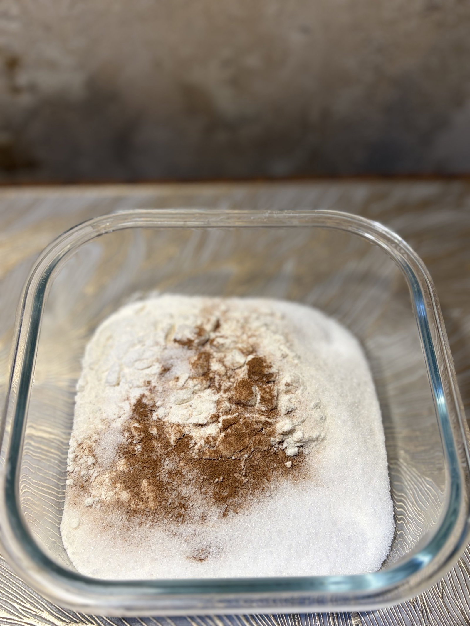 In a bowl, whisk flour, sugar, baking powder, cinnamon, nutmeg, and salt.