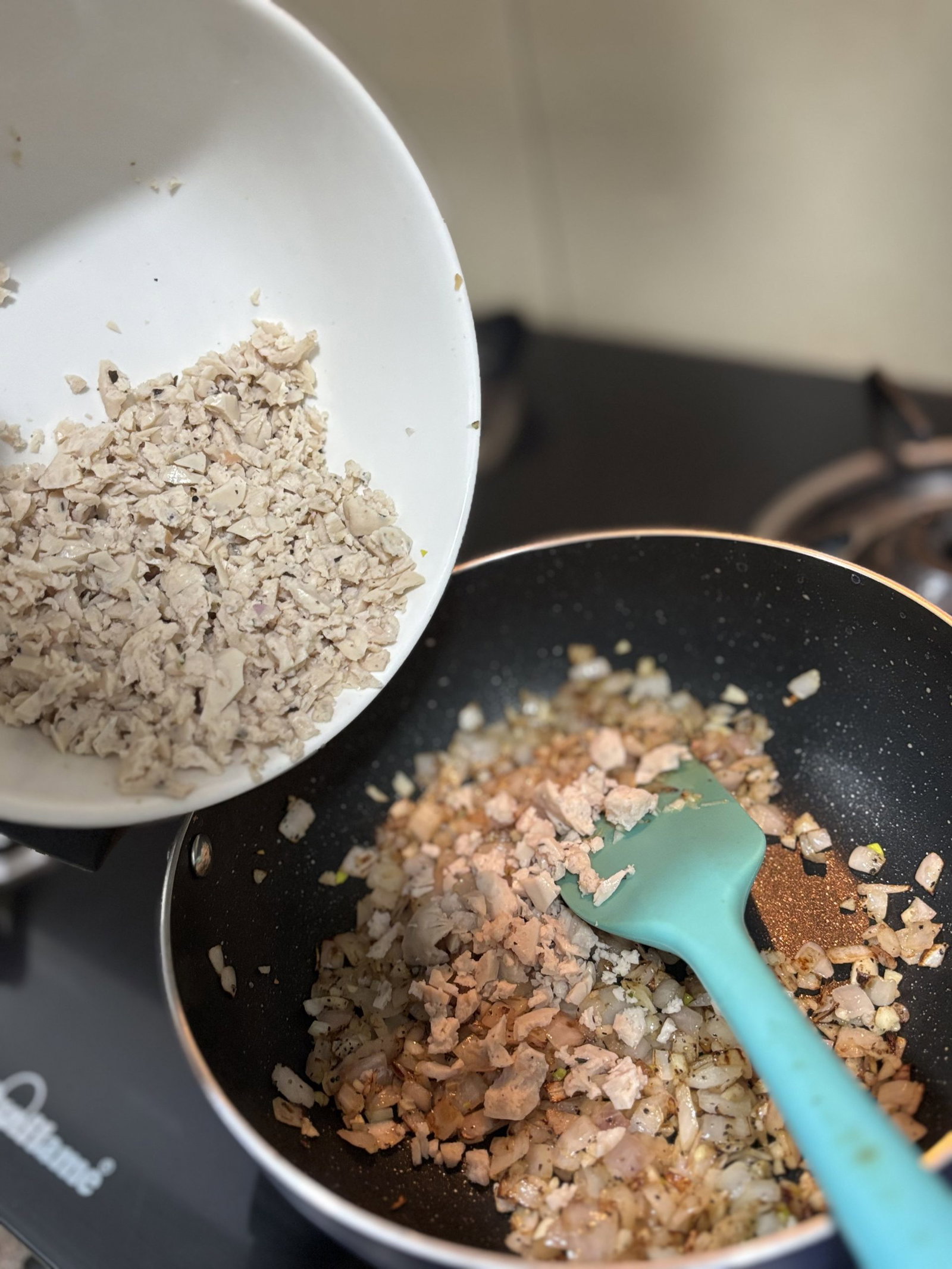 Increase the heat to medium and add ground sausage.
