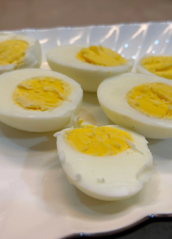 Peel the eggs and slice them in half lengthwise