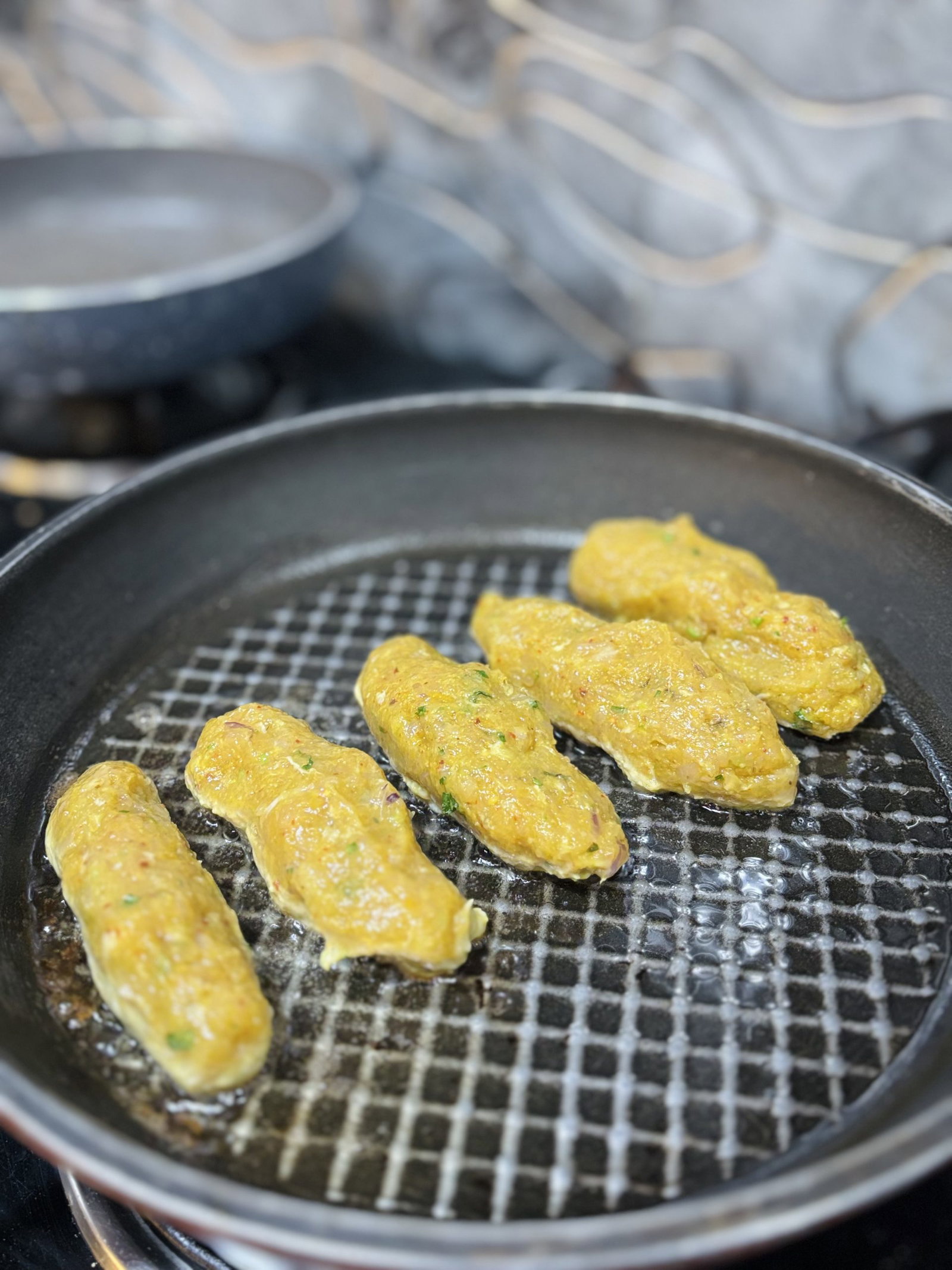 Place kababs on the pan and cook without moving for 3–4 minutes