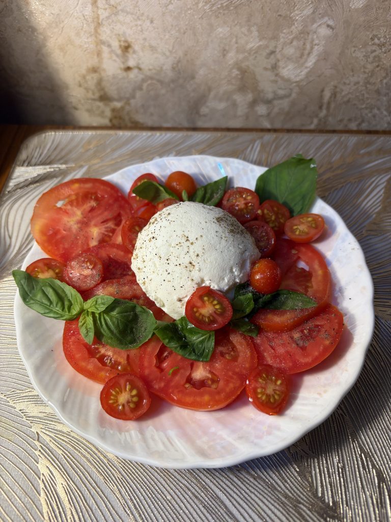 Place the burrata ball gently in the center or pull it apart into soft chunks