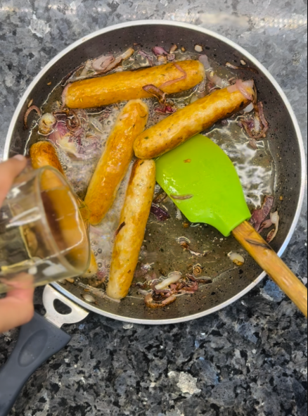 Pour the beer into the skillet with the onions