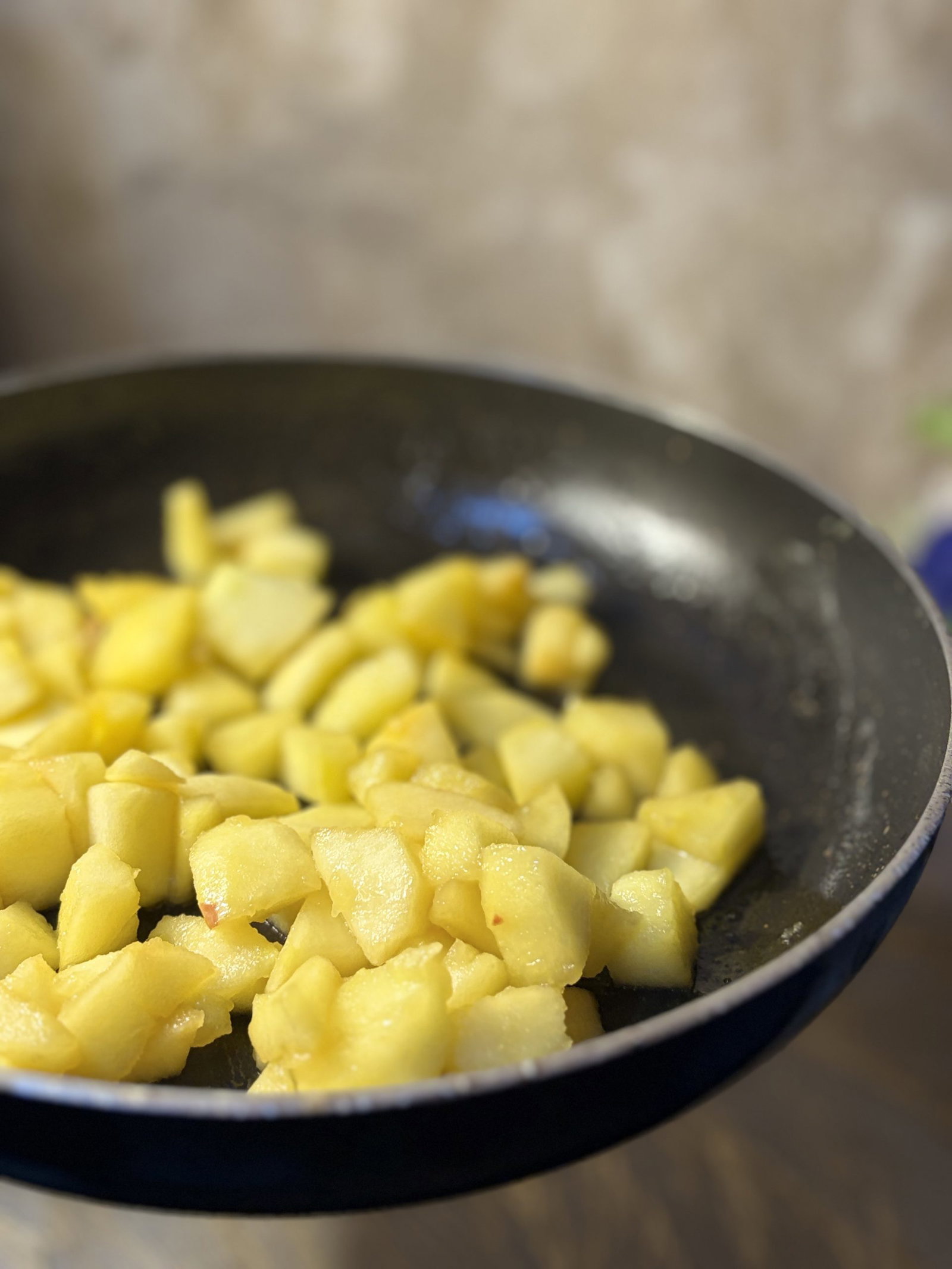 Sauté the diced apples with butter and brown sugar until soft and caramelized.