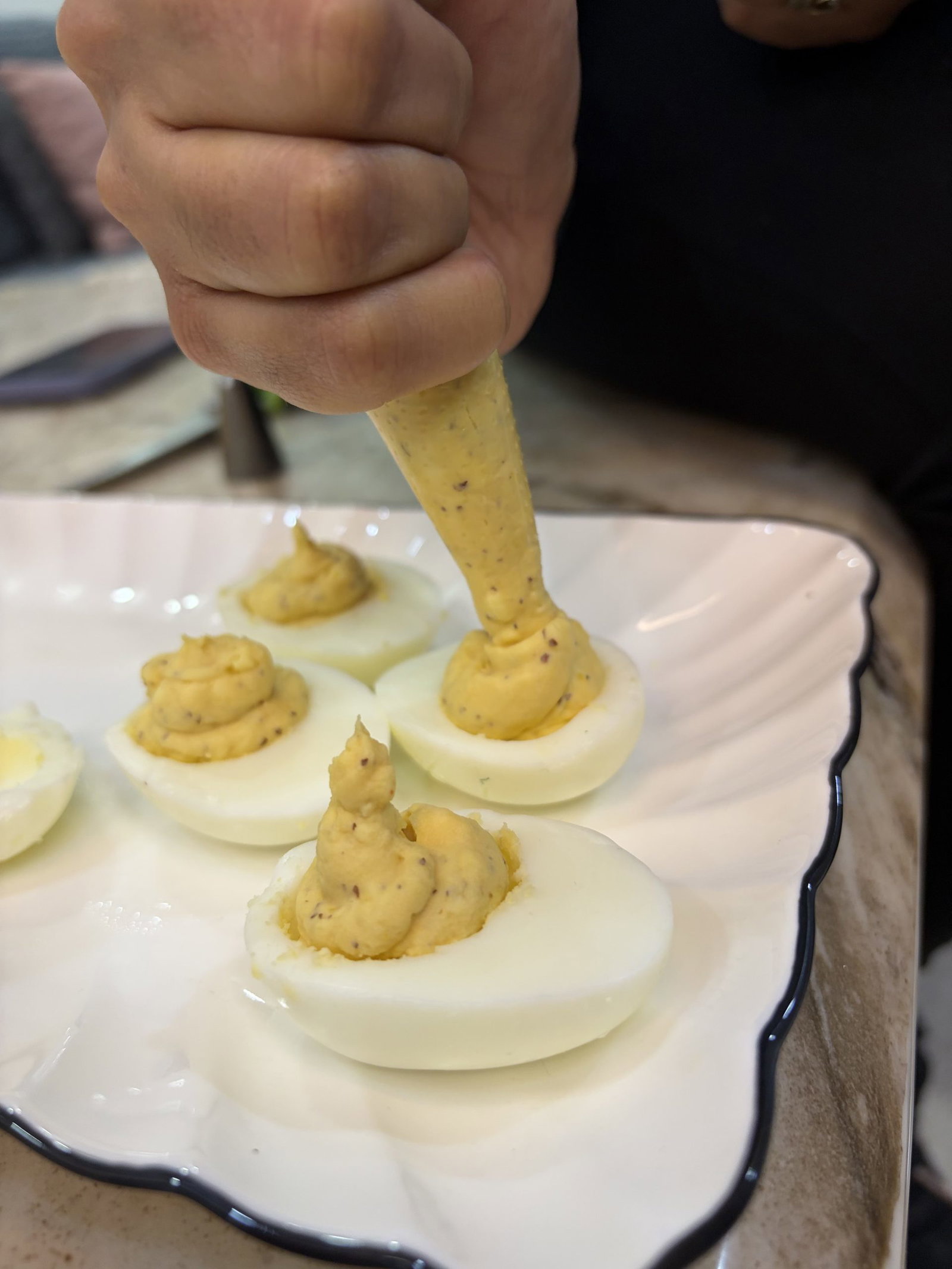 Spoon or pipe the yolk mixture back into each egg white half