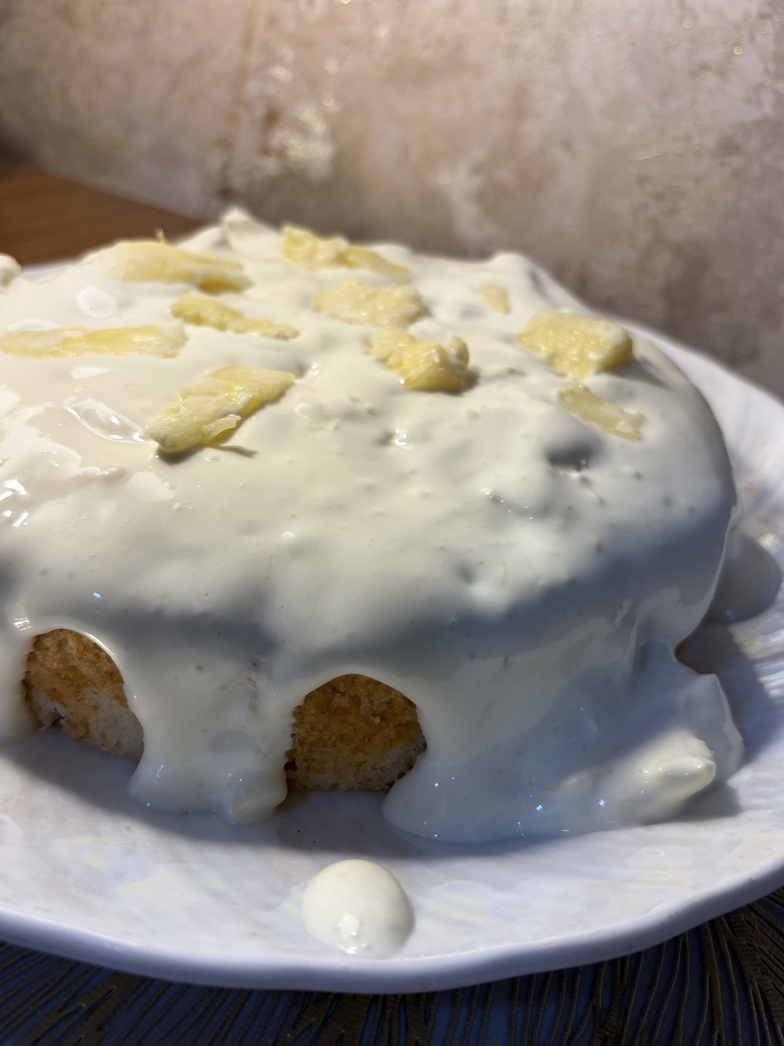 Spread this creamy pineapple mixture evenly over the cooled cake.