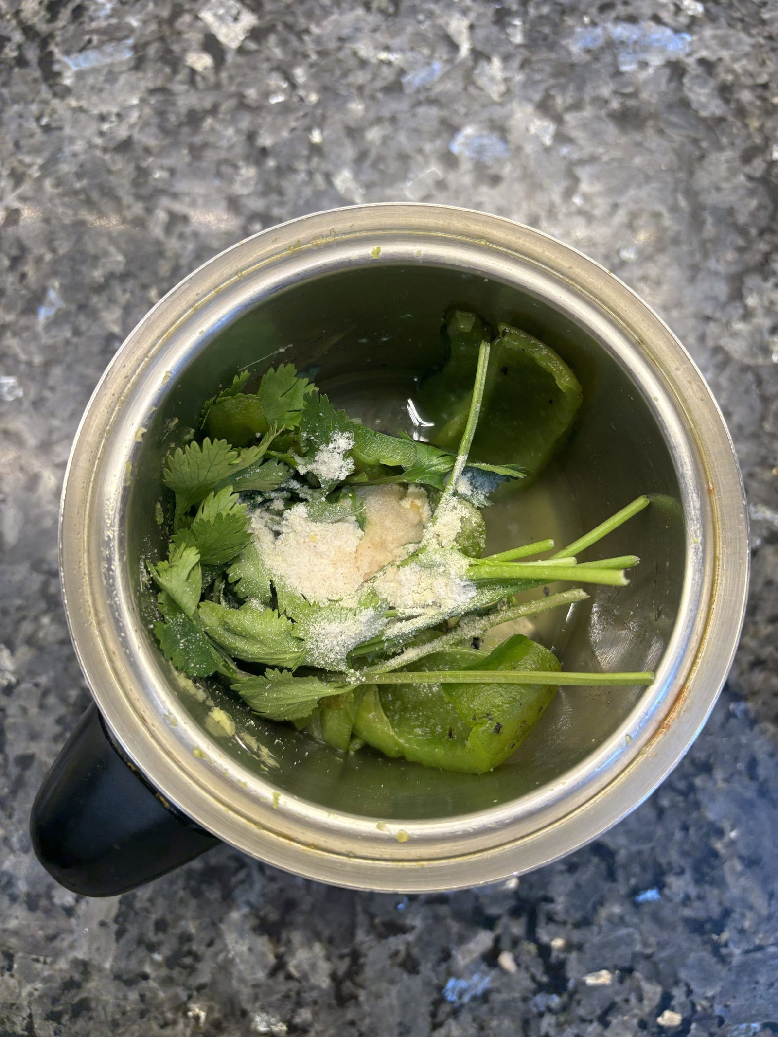 Transfer the sautéed poblano, onion, and garlic mixture to a blender. Add cilantro, ¼ teaspoon salt, and ½ cup chicken stock. Blend until smooth
