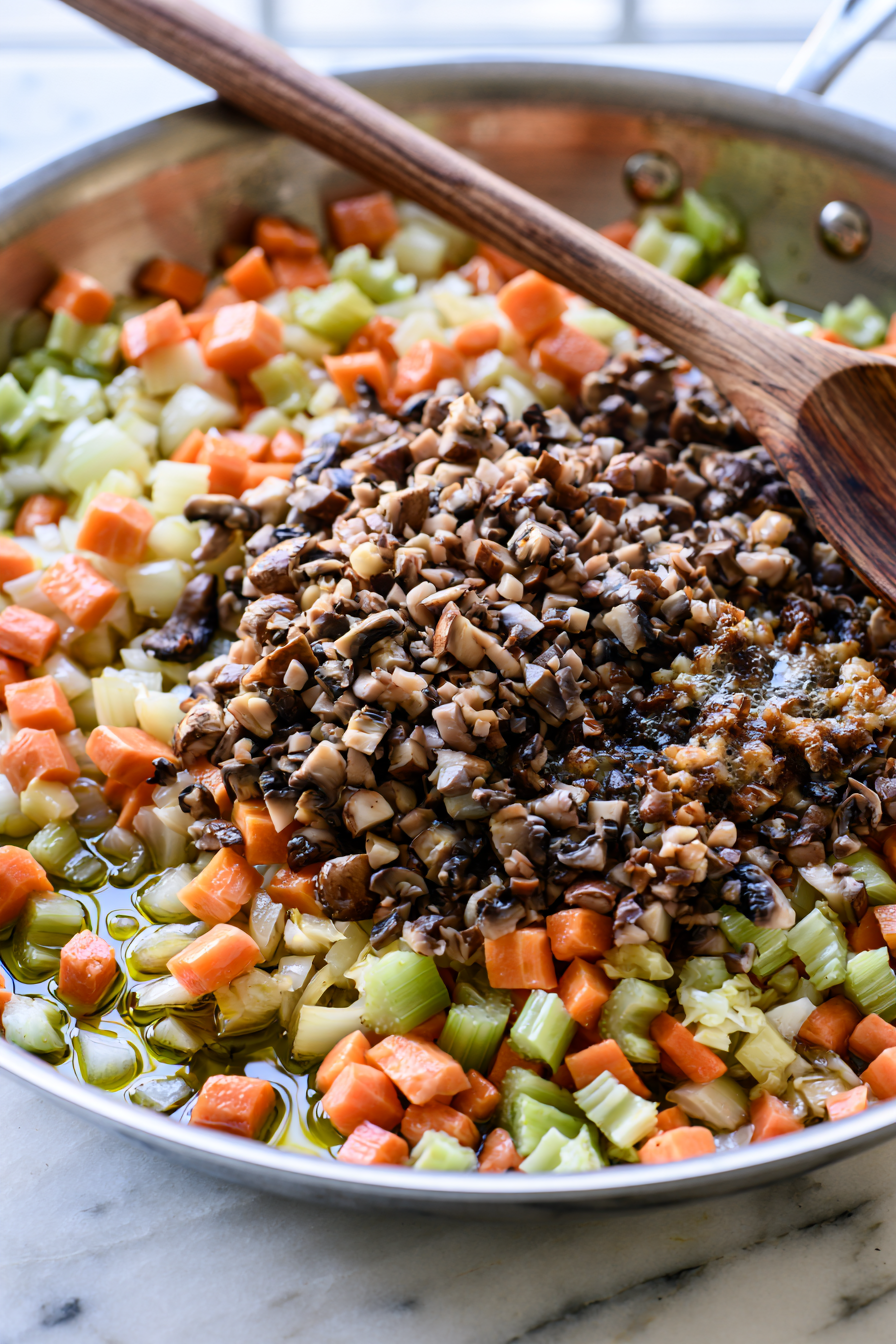 Add the onion, carrots, and celery, cooking until softened, about 7 to 8 minutes