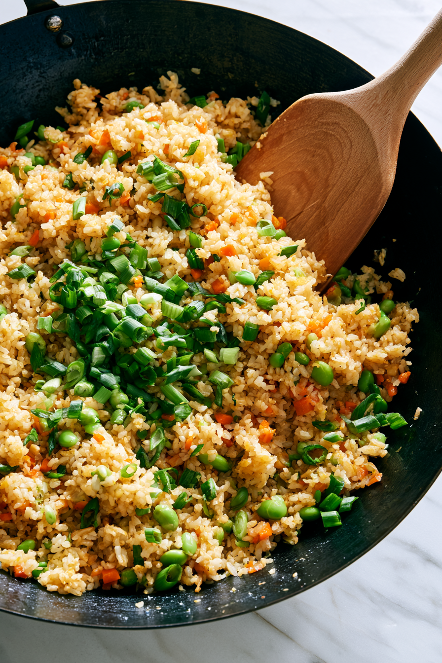 Fold in most of the sliced green onions and stir everything together.