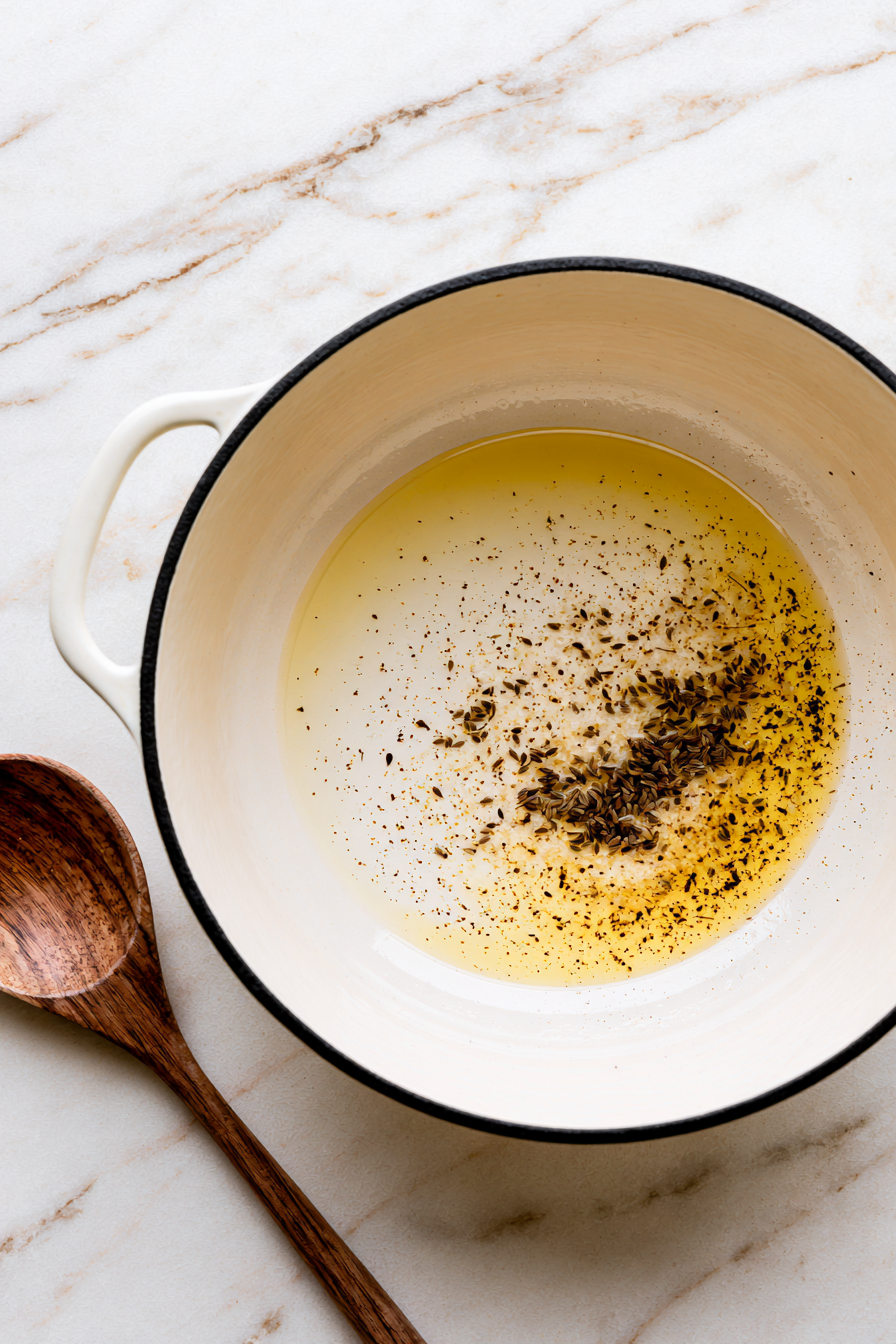 Heat the coconut oil in a large Dutch oven or deep skillet over medium heat
