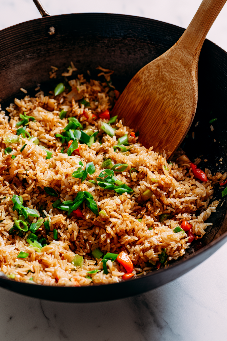 Pour the prepared sauce over the rice and toss well so every grain is evenly coated. Continue cooking for another 2 minutes.