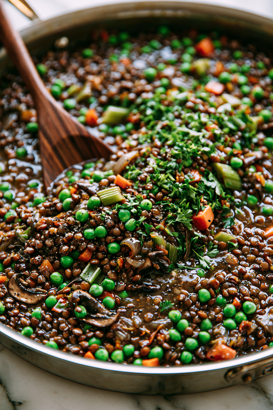 Stir in the frozen peas and chopped parsley