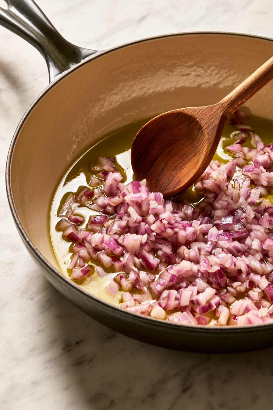 Heat olive oil in a large skillet over medium-high heat. Add the onion and cook for 2 minutes until softened.