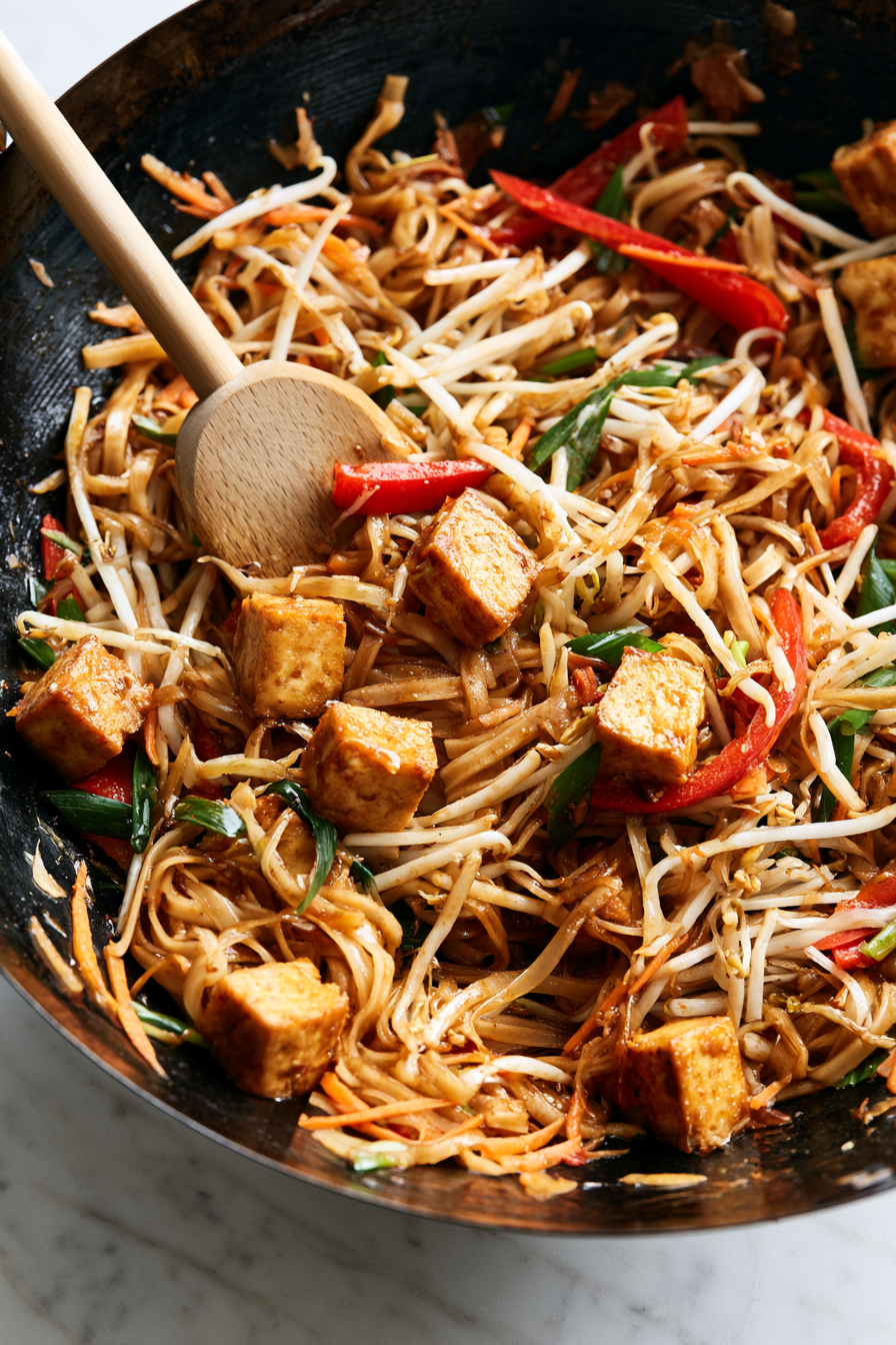 Return the crispy tofu to the skillet and add the bean sprouts and green onions. Toss everything together until evenly combined and heated through