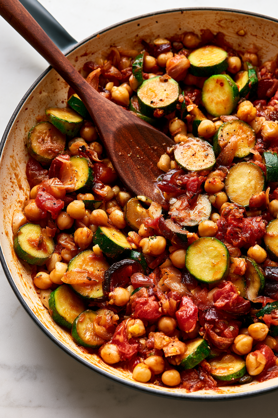 Stir in the chickpeas, diced tomatoes, and maple syrup. Cover and simmer for 5 minutes