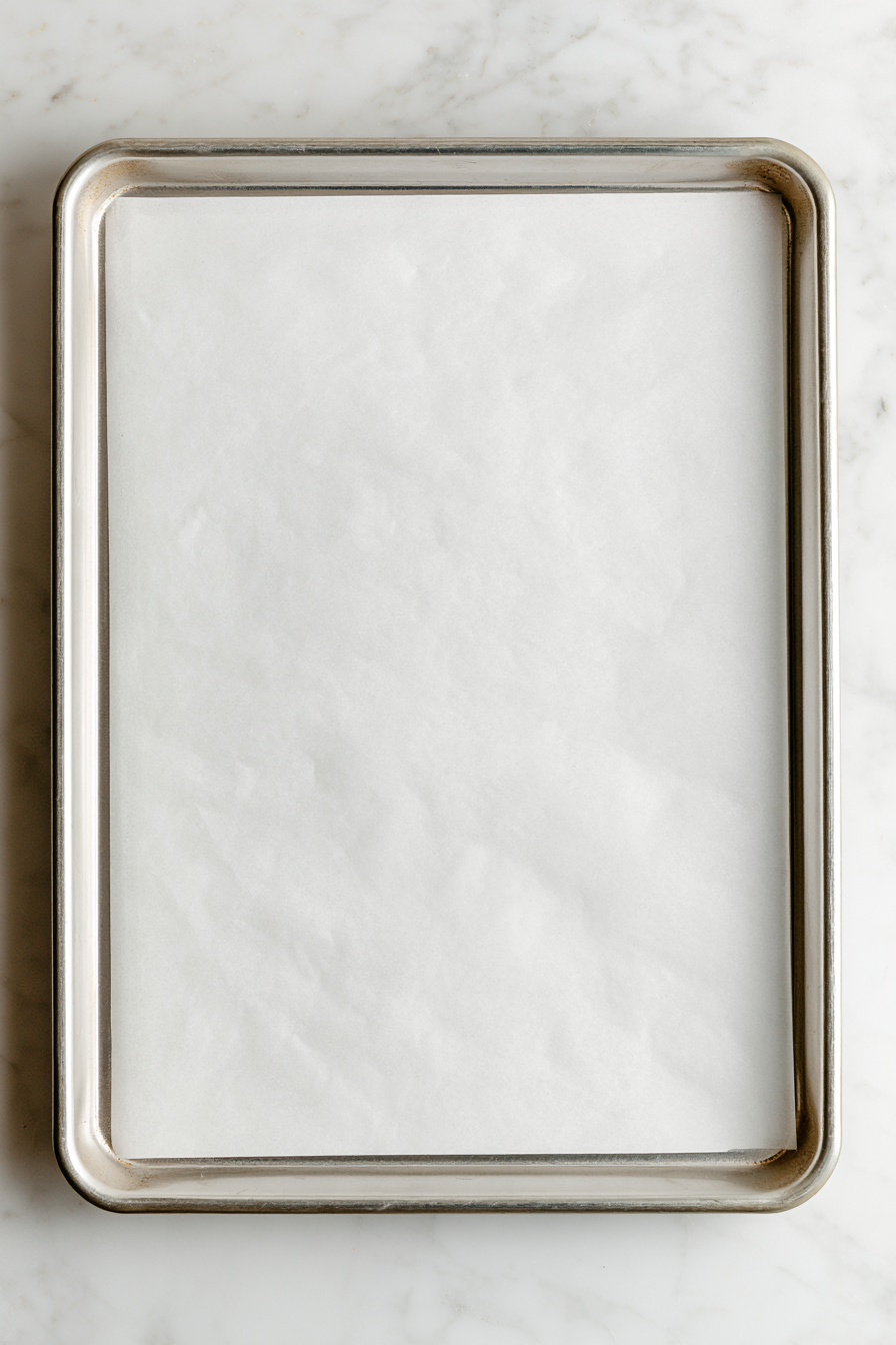 line a rimmed baking sheet with parchment paper