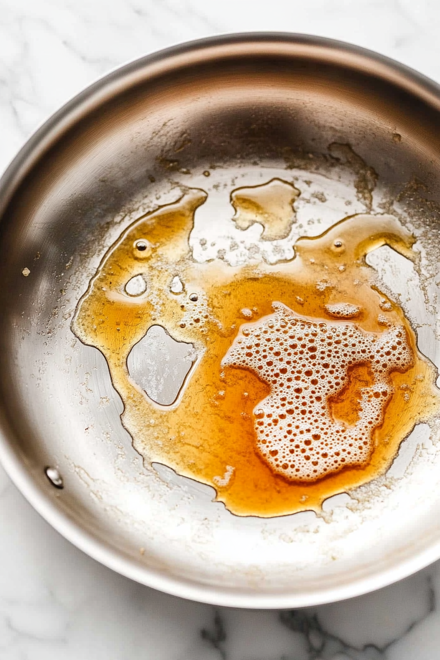 Melt the butter in a medium stainless steel skillet over medium heat